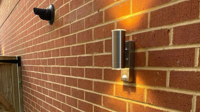 A spotlight on an exterior brick wall